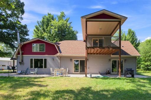 Back patio and upper deck overlooking pond