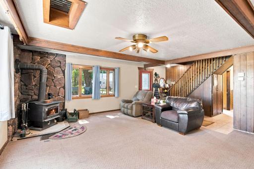 Spacious living room with cozy wood burning fireplace