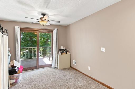 Family room 26x13 w/ walkout to upper deck overlooking back yard and pond