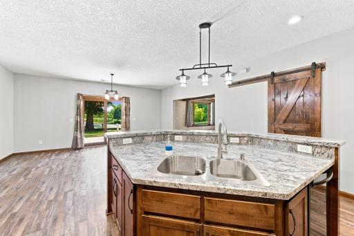 Center island open to dining and living areas perfect for gathering and entertaining