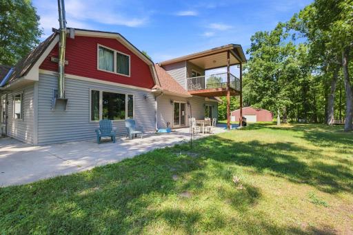 Back patio and upper deck overlooking pond