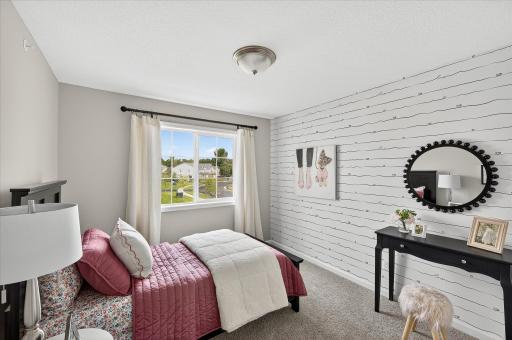 Bedroom 2 - photos are of a staged model home of the same floorplan