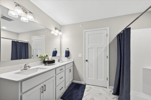 Upstairs Full Bath - photos are of a staged model home of the same floorplan