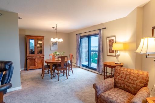 Dining area with access to balcony.