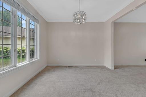 Formal dining area with new chandelier.