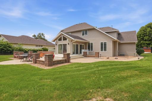 Large patio area with underground sprinkler system installed. Newer landscaping with rock around the house.