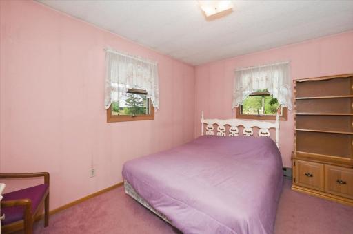 Second / primary bedroom. There are two additional dressers that are not pictured and fit easily in this large room.