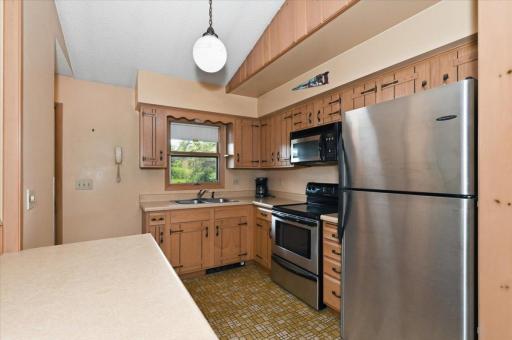 The kitchen provides a good amount of counter and cabinet space. The updated stainless steel appliances, the window above the sink and the island counter space are a few added bonuses!