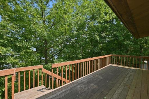 Large deck overlooking the beautiful green space and lake.