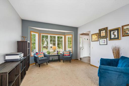 The welcoming main level features an open and functional floor plan with two spacious gathering areas.