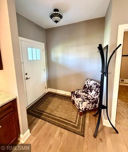 Spacious entry next to mudroom with large closet.