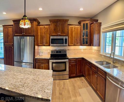 Beautiful custom cabinets with a great deal of counter space.
