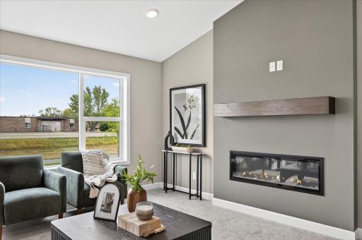 Living room - photos are of a staged model home of the same floorplan. Selections and colors may differ.