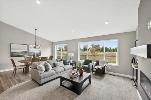 Living room that features so much natural light! - photos are of a staged model home of the same floorplan. Selections and colors may differ.