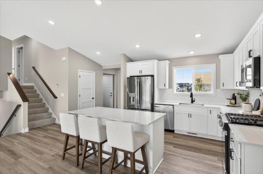 Kitchen - photos are of a staged model home of the same floorplan. Selections and colors may differ.