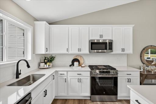 Kitchen - photos are of a staged model home of the same floorplan. Selections and colors may differ.