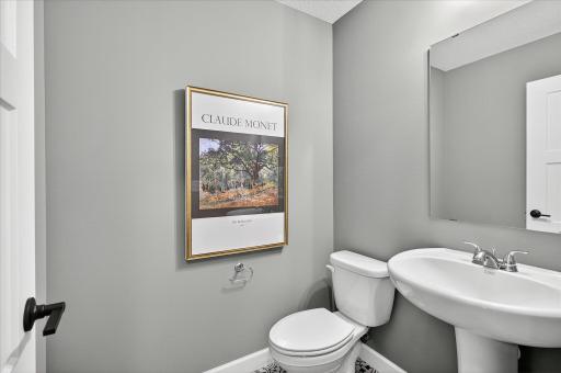 Powder room - photos are of a staged model home of the same floorplan. Selections and colors may differ.