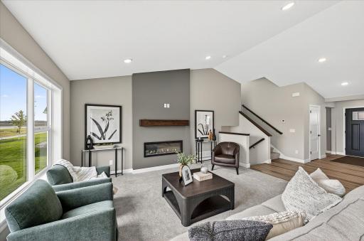 Living room - photos are of a staged model home of the same floorplan. Selections and colors may differ.