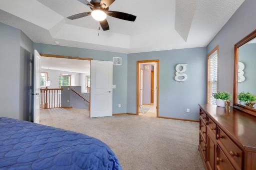 The impressive primary suite offers a peaceful retreat at the back of the home, complete with a private full bathroom and a large walk-in closet designed with both comfort and functionality in mind.