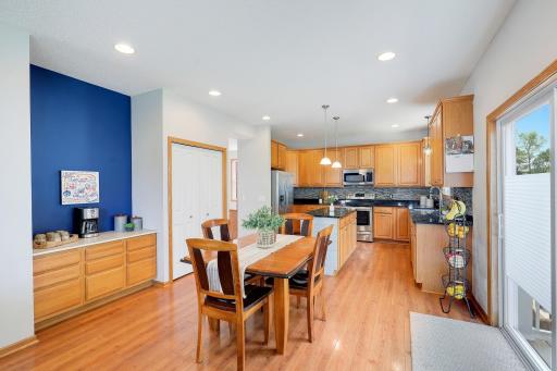 The kitchen, dining area, and living room are thoughtfully situated along the back of the home, creating an open-concept layout that's perfect for everyday living and entertaining while taking advantage of backyard views and natural light.