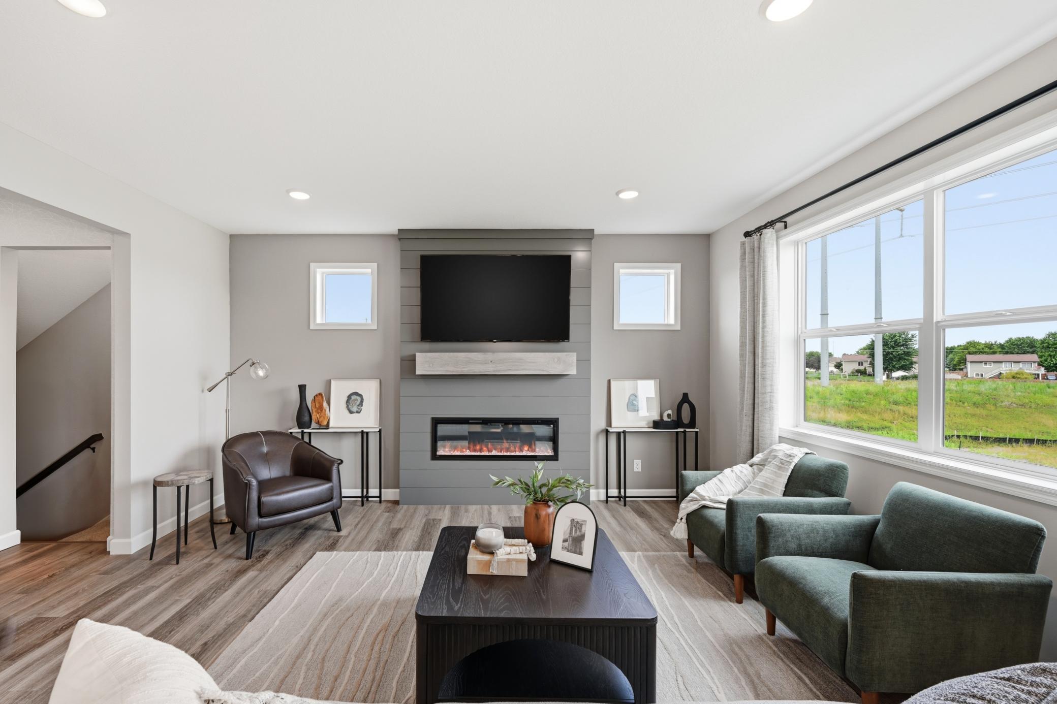 Living room - photos of a staged, completed model, of the same floorplan for illustrative purposes.