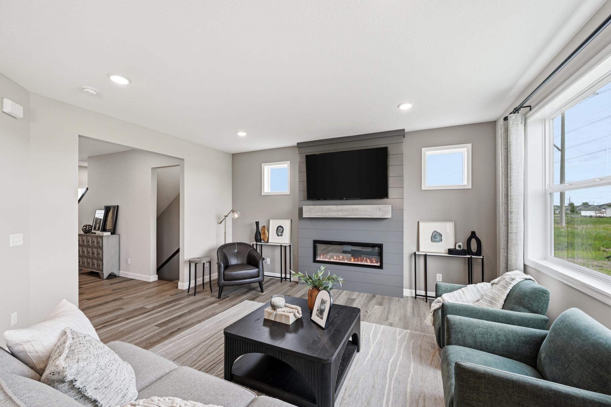 Living room - photos of a staged, completed model, of the same floorplan for illustrative purposes.