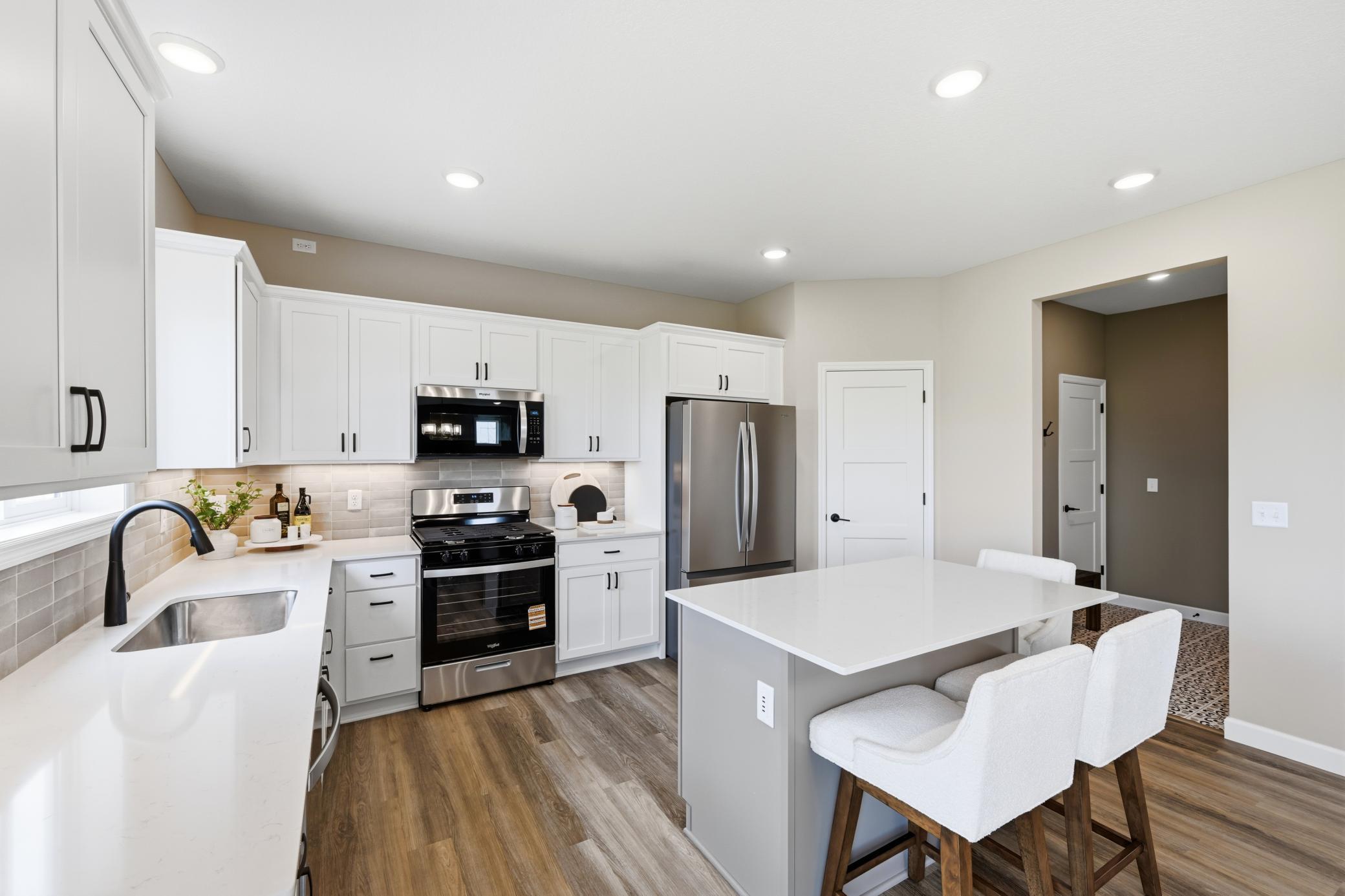 Kitchen - photos of a staged, completed model, of the same floorplan for illustrative purposes.