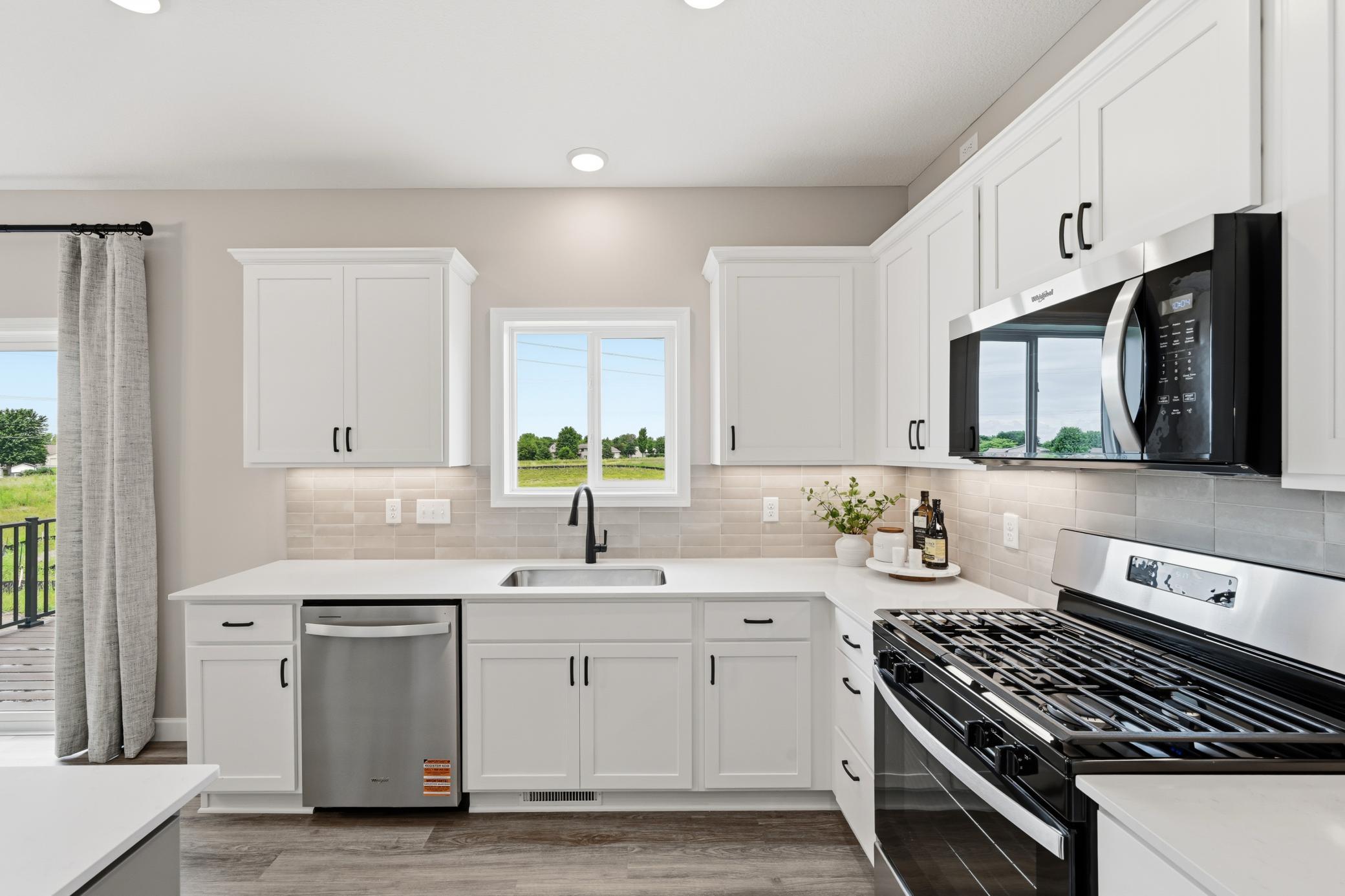 Kitchen - photos of a staged, completed model, of the same floorplan for illustrative purposes.