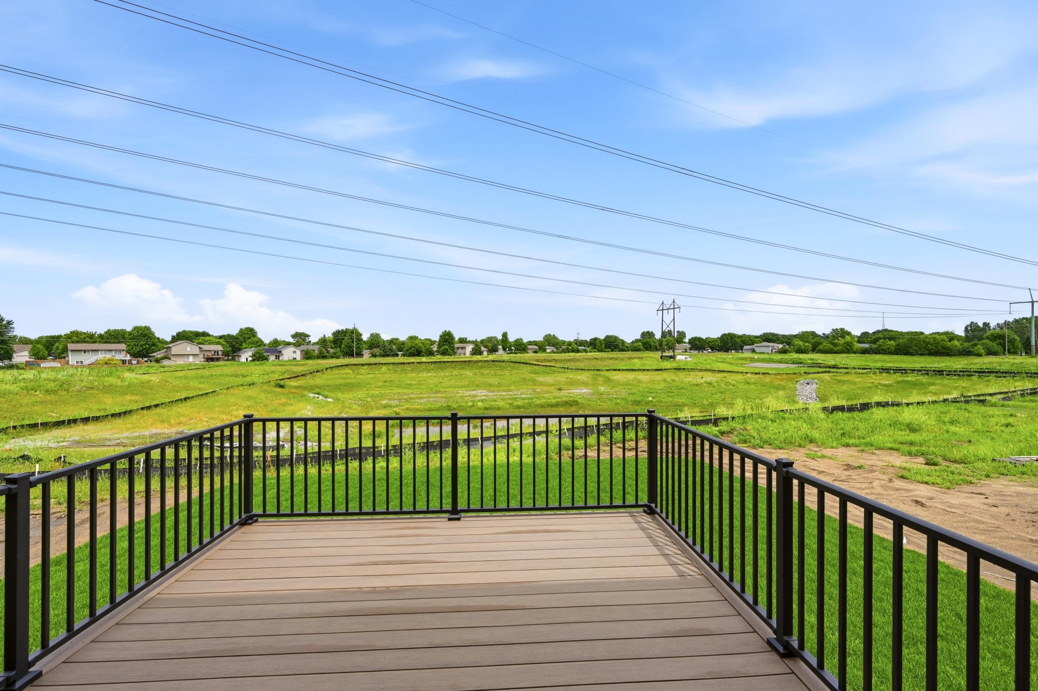Maintenance free deck - photos of a staged, completed model, of the same floorplan for illustrative purposes.