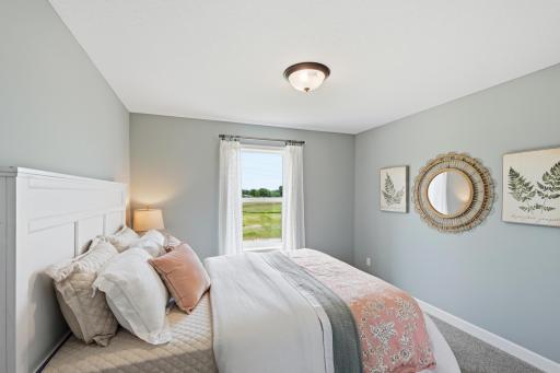 Bedroom 1 - photos of a staged, completed model, of the same floorplan for illustrative purposes.