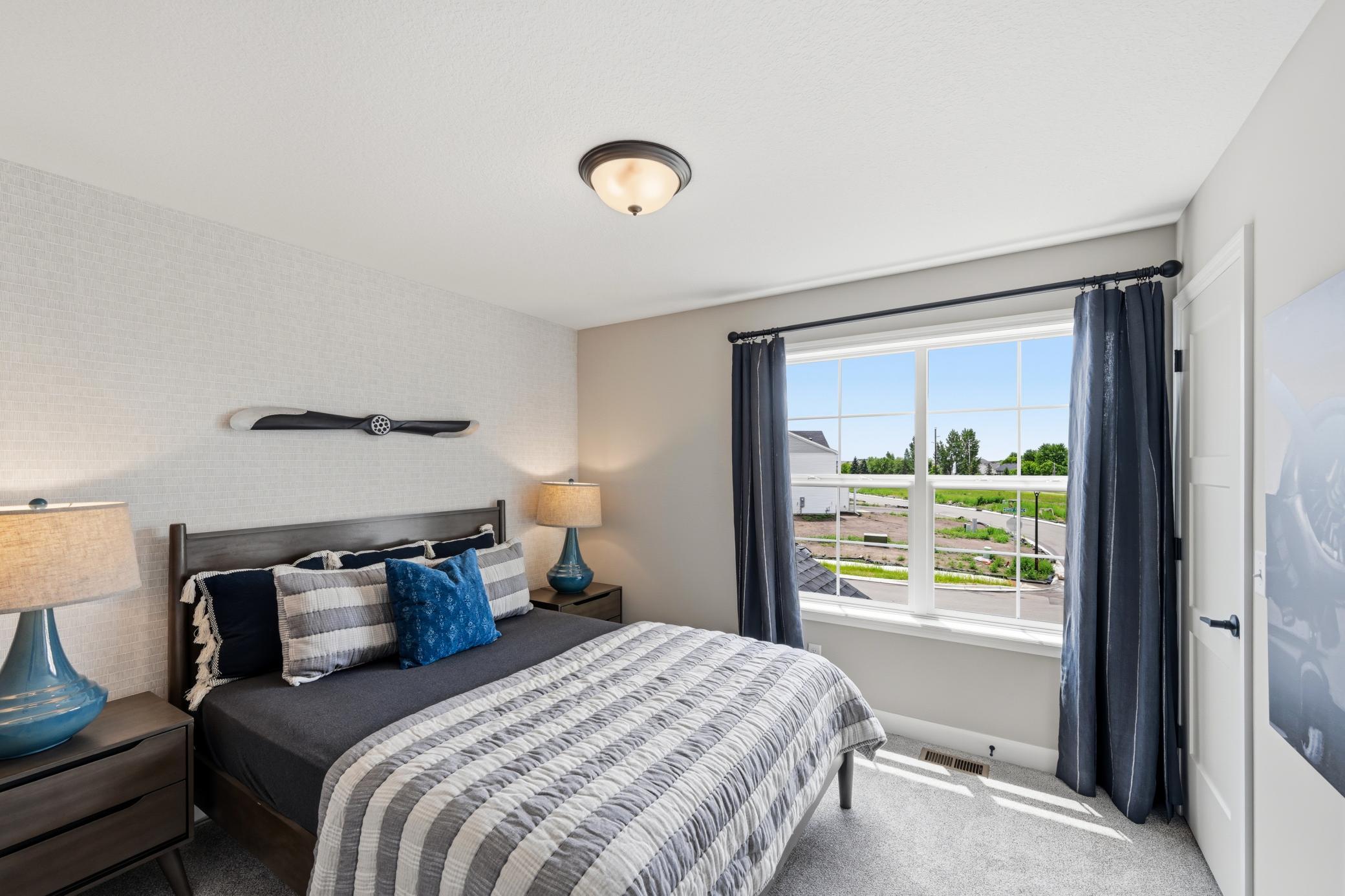 Bedroom 2 - photos of a staged, completed model, of the same floorplan for illustrative purposes.