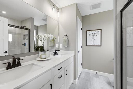 Primary suite bathroom - photos of a staged, completed model, of the same floorplan for illustrative purposes.