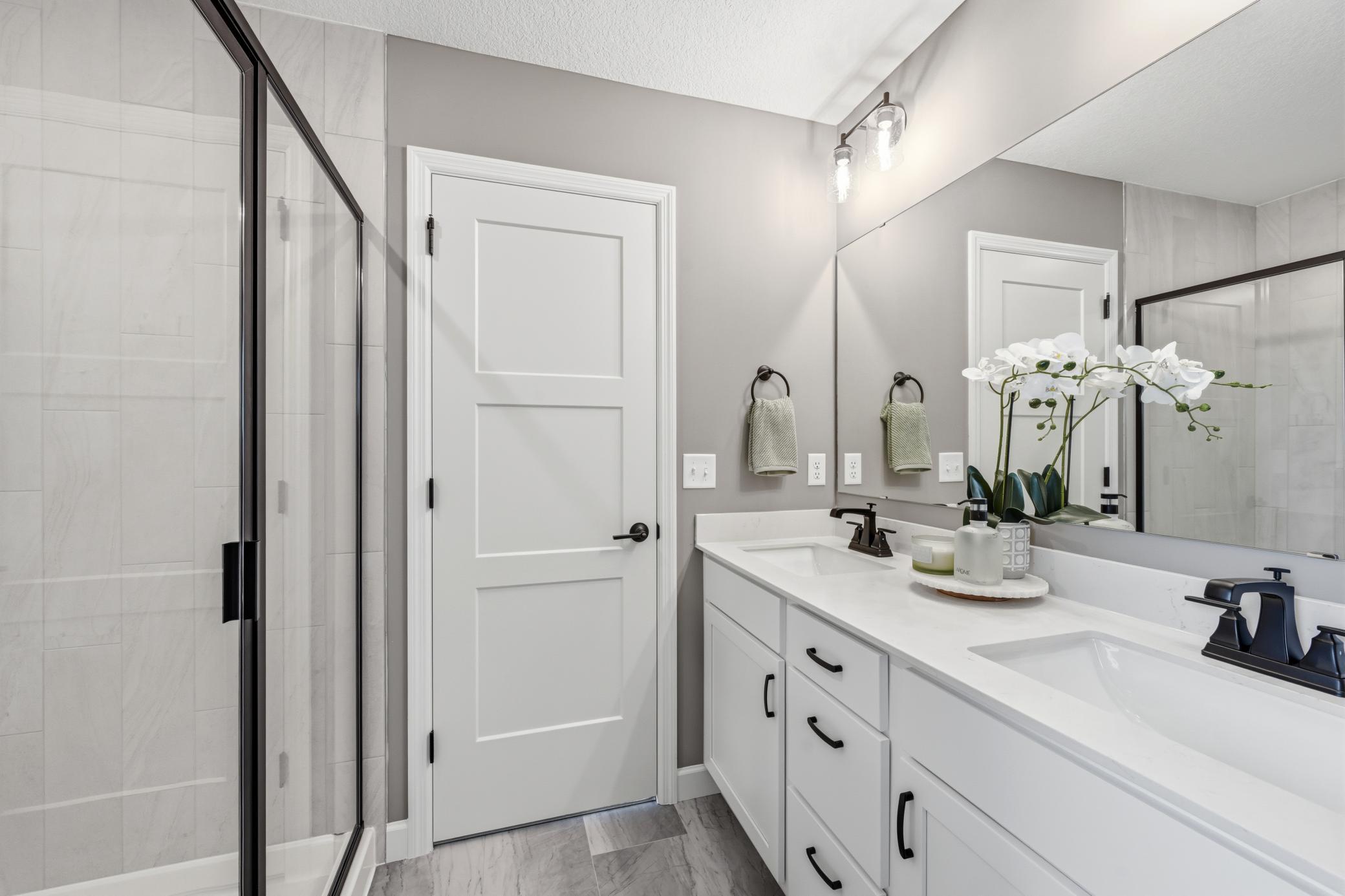 Primary suite bathroom - photos of a staged, completed model, of the same floorplan for illustrative purposes.