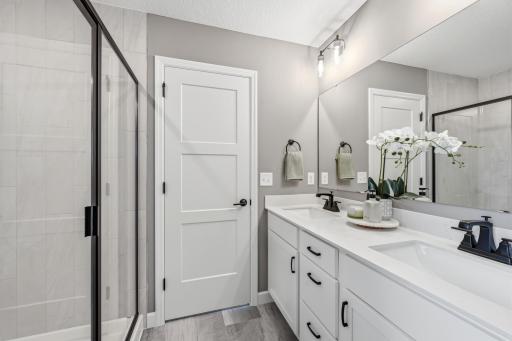 Primary suite bathroom - photos of a staged, completed model, of the same floorplan for illustrative purposes.