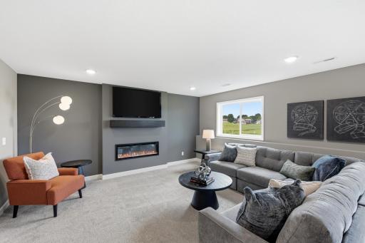 Lower level family room - photos of a staged, completed model, of the same floorplan for illustrative purposes.
