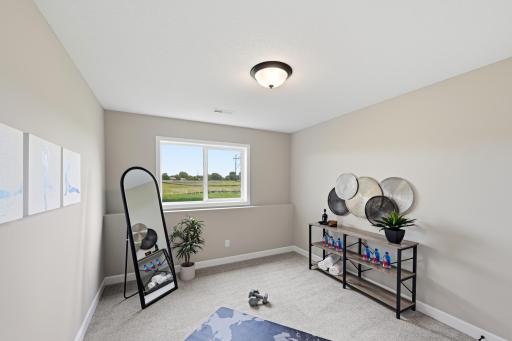 Bedroom 5 - photos of a staged, completed model, of the same floorplan for illustrative purposes.