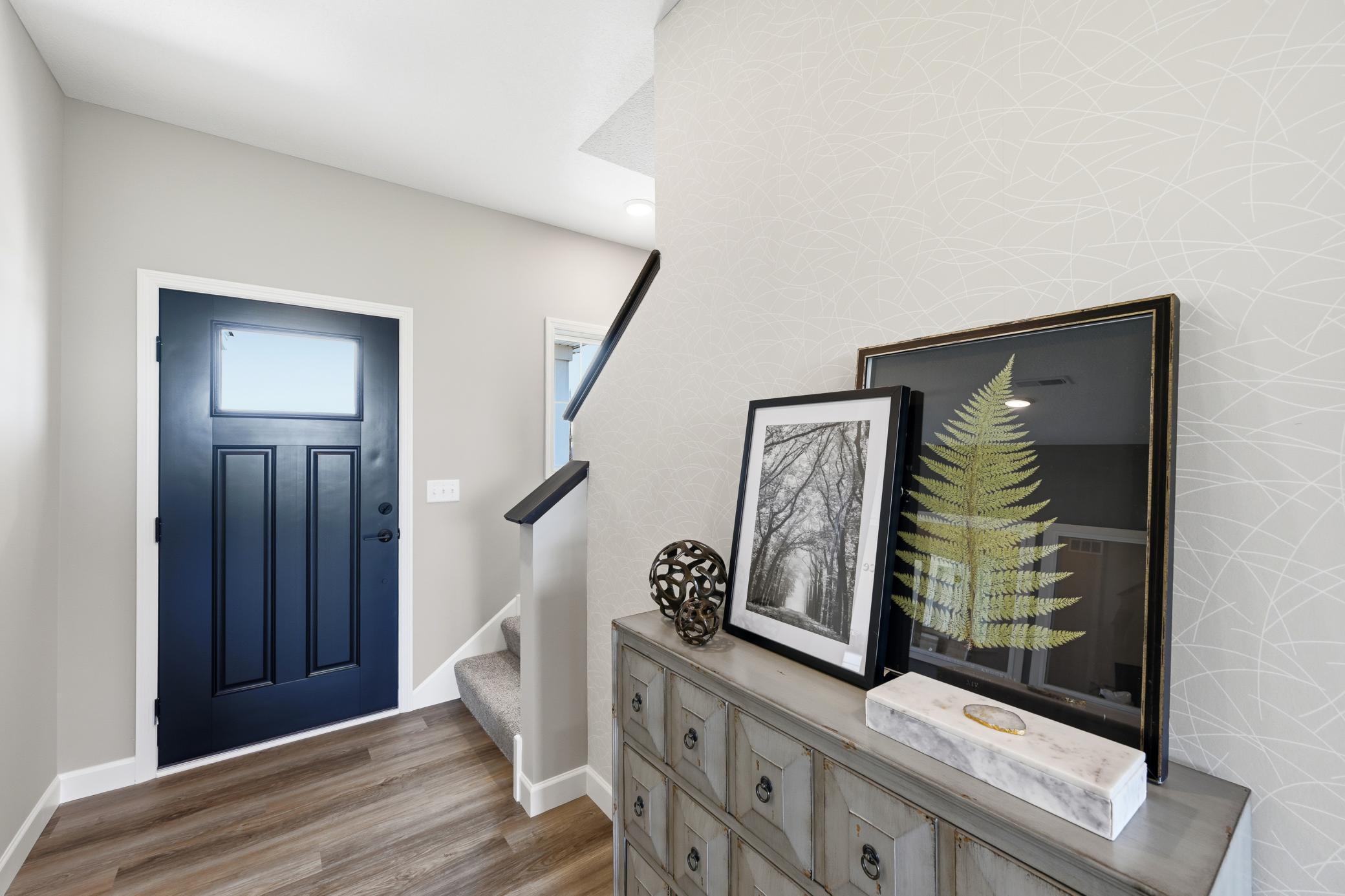 Entry - photos of a staged, completed model, of the same floorplan for illustrative purposes.