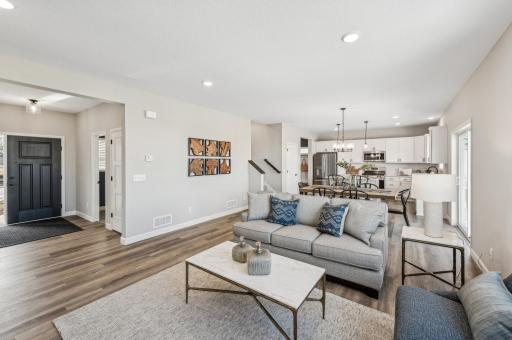 Living room - photo is of a staged model home of the same floorplan. Selections and colors may differ.