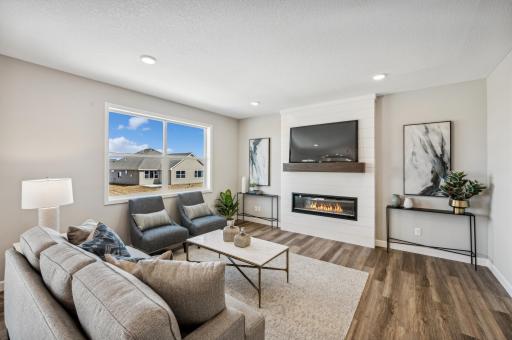 Living room - photo is of a staged model home of the same floorplan. Selections and colors may differ.