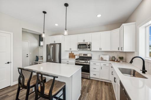 Kitchen - photo is of a staged model home of the same floorplan. Selections and colors may differ.