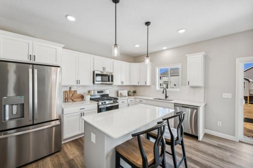 Kitchen - photo is of a staged model home of the same floorplan. Selections and colors may differ.