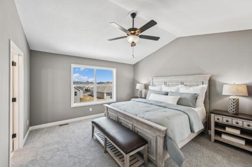 Primary suite - photo is of a staged model home of the same floorplan. Selections and colors may differ.