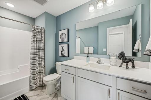 Full bathroom -photo is of a staged model home of the same floorplan. Selections and colors may differ.