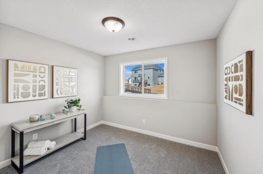 Bedroom 5 - photo is of a staged model home of the same floorplan. Selections and colors may differ.