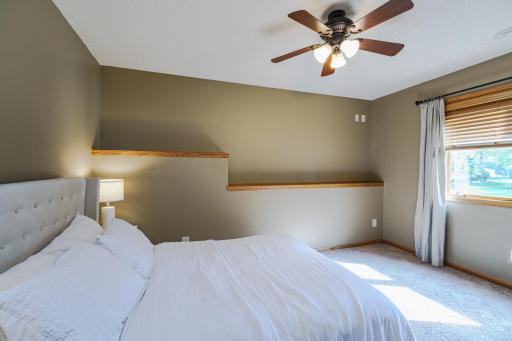 The bedroom has daylight windows and plenty of space for guests.
