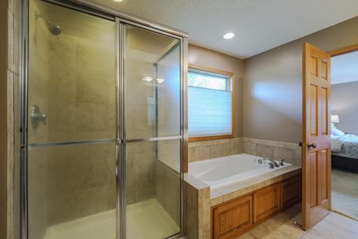The primary suite also has receives lots of natural light and has a private commode and a walk-in closet.