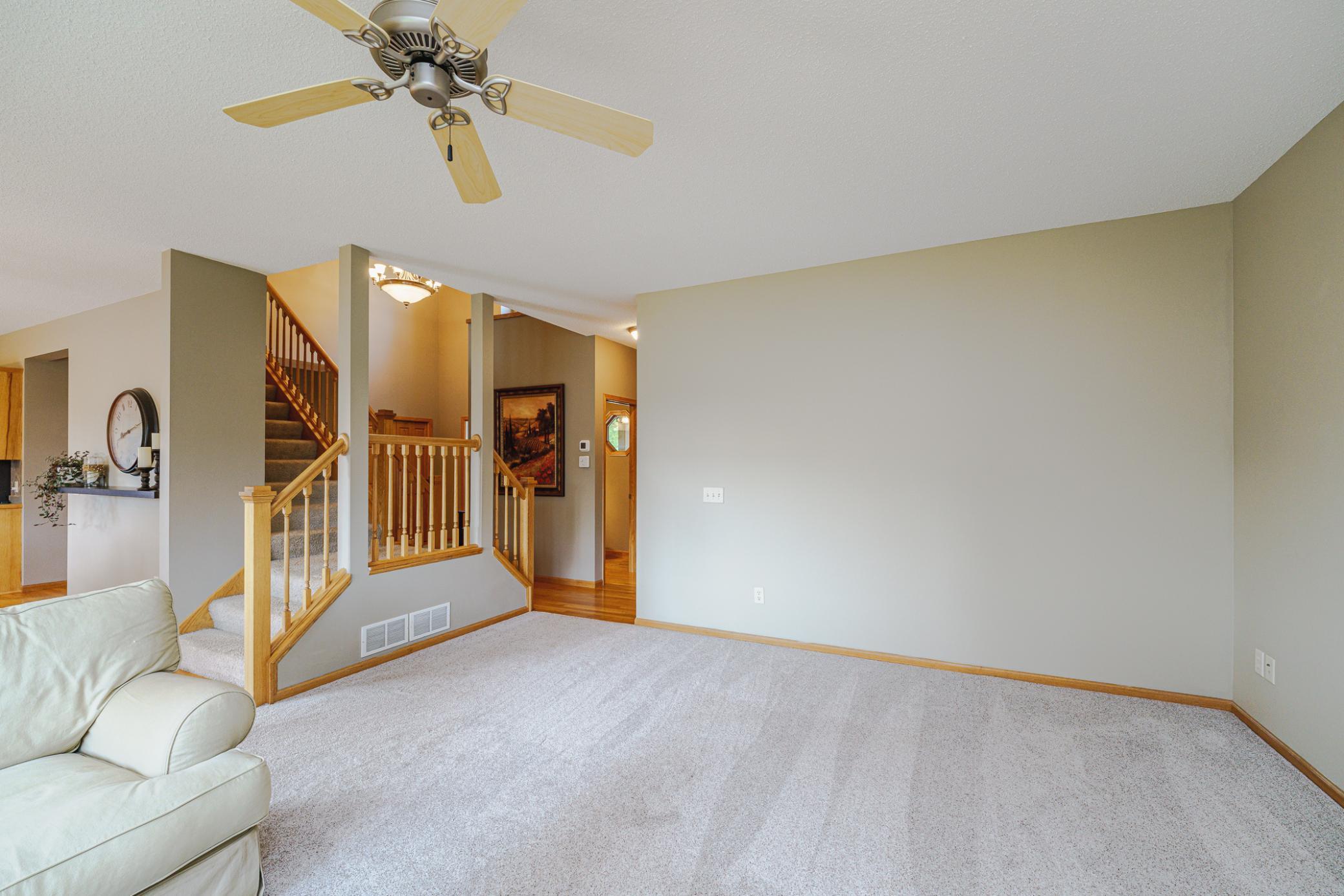 A unique DUAL STAIRCASE leads to the upper level.