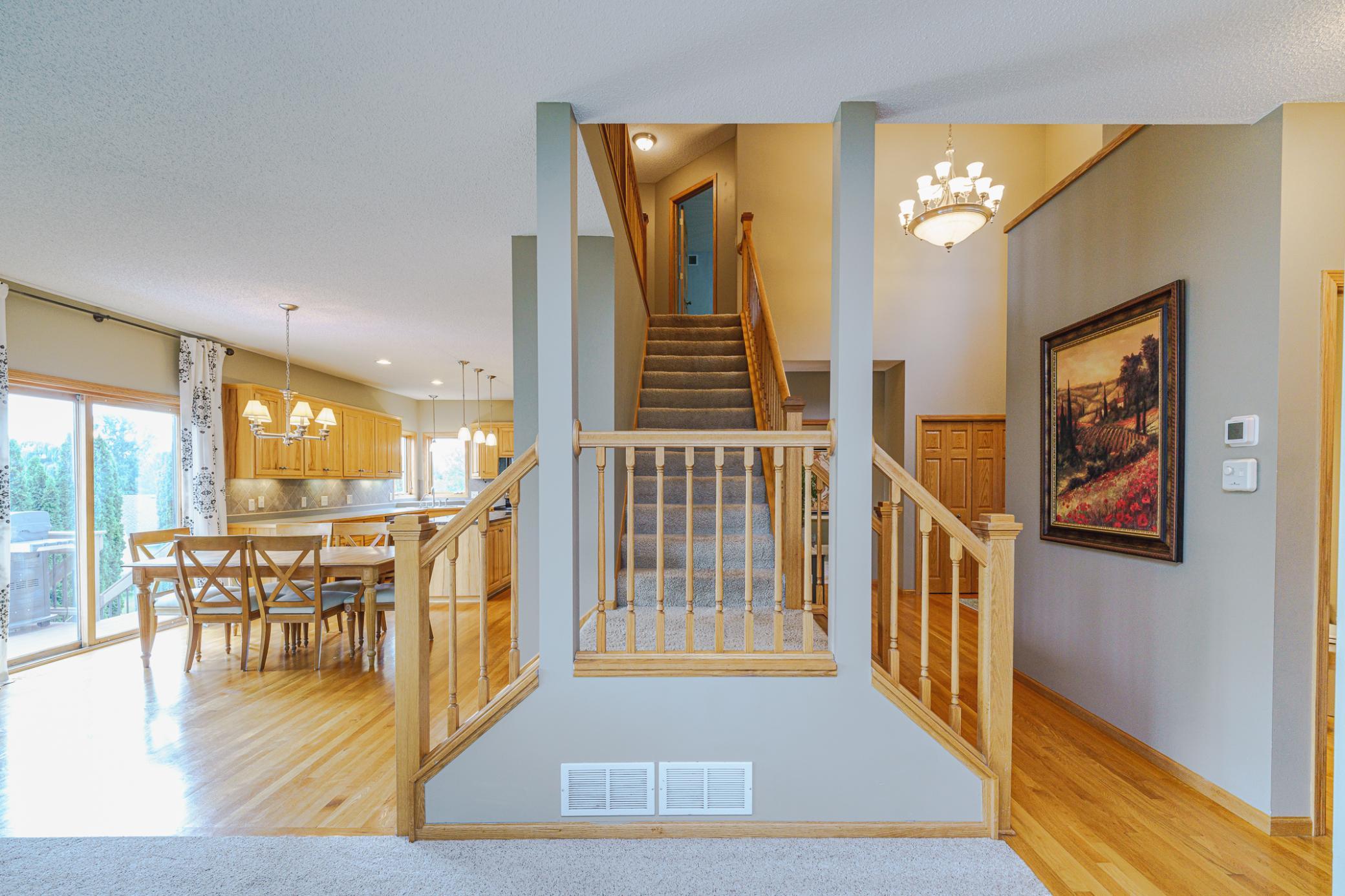 The dual staircase is accessible from the kitchen or foyer.