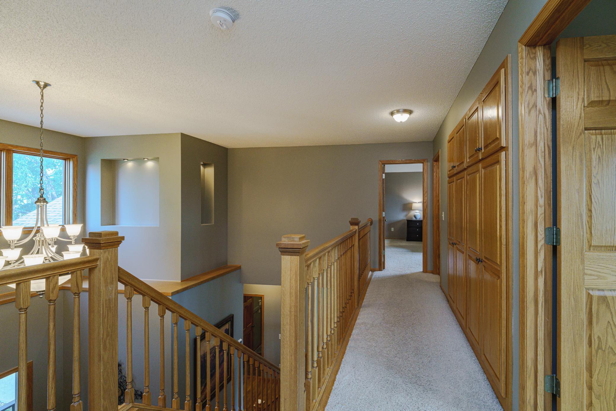 The upper hall has lots of storage cabinetry.