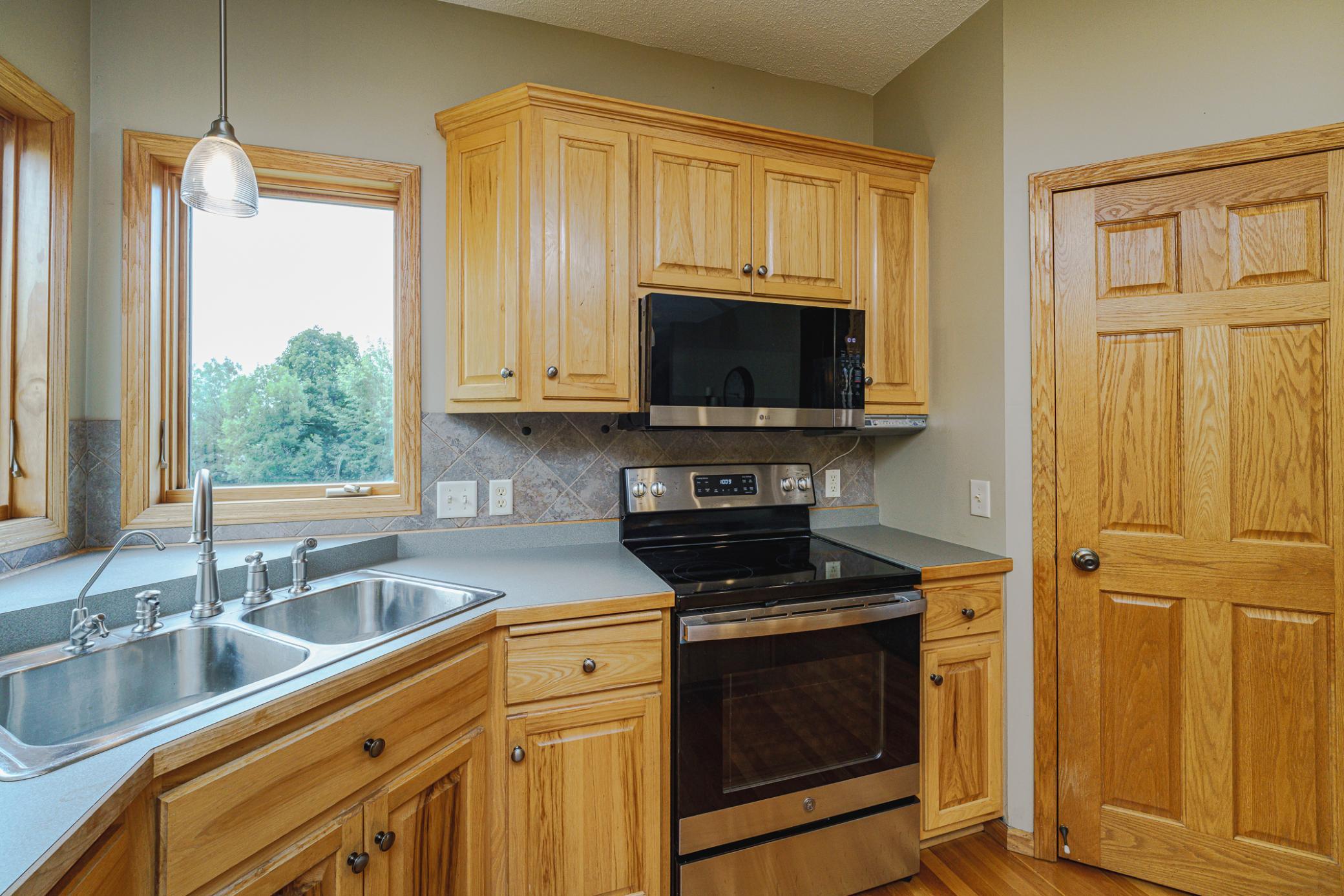 A corner pantry and roll-out shelves keep things organized. The range and refrigerator are new as of 2025.